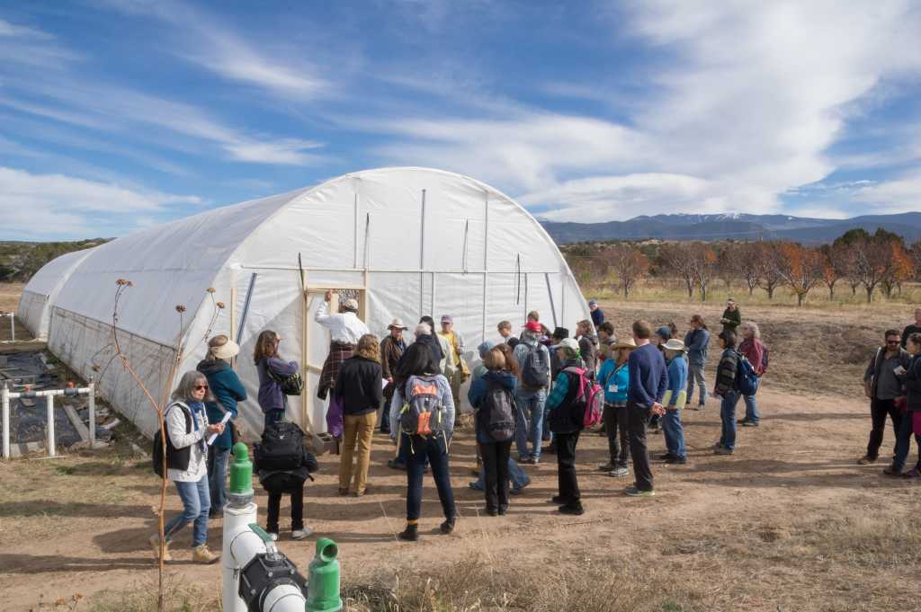 Touring the greenhouse at Tesuque Pueblo