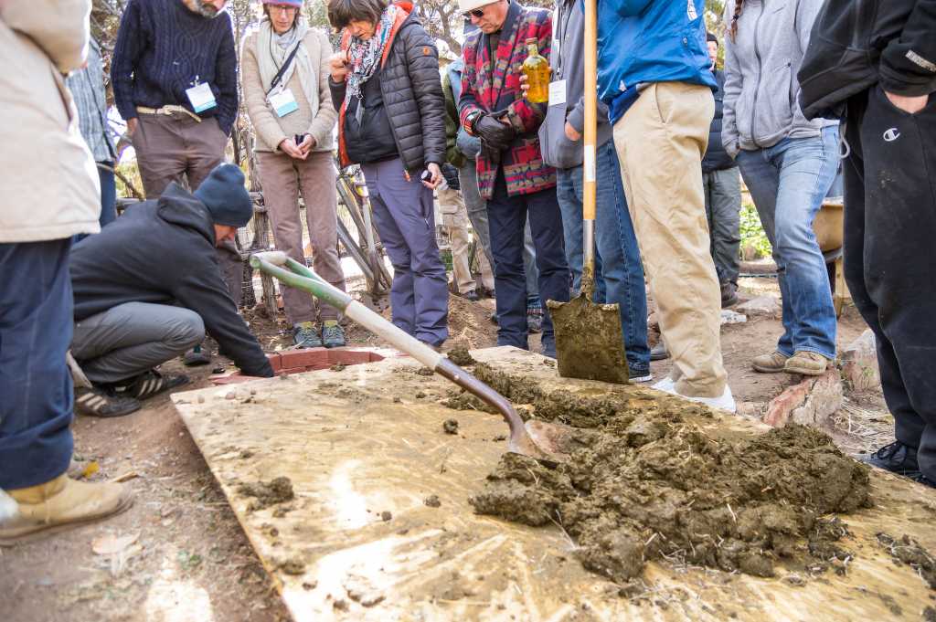 Making barrel compost during Hands-On with the Biodynamic Preparations pre-conference field day at the Santa Fe Waldorf School