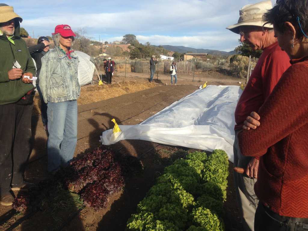 Sam Hitt demonstrates examples of season extension including cold frames and tunnels, intensively grown vegetables in raised and in-ground beds, a wide variety of succulent plants, and the compost system during field trip to The Succulent Garden