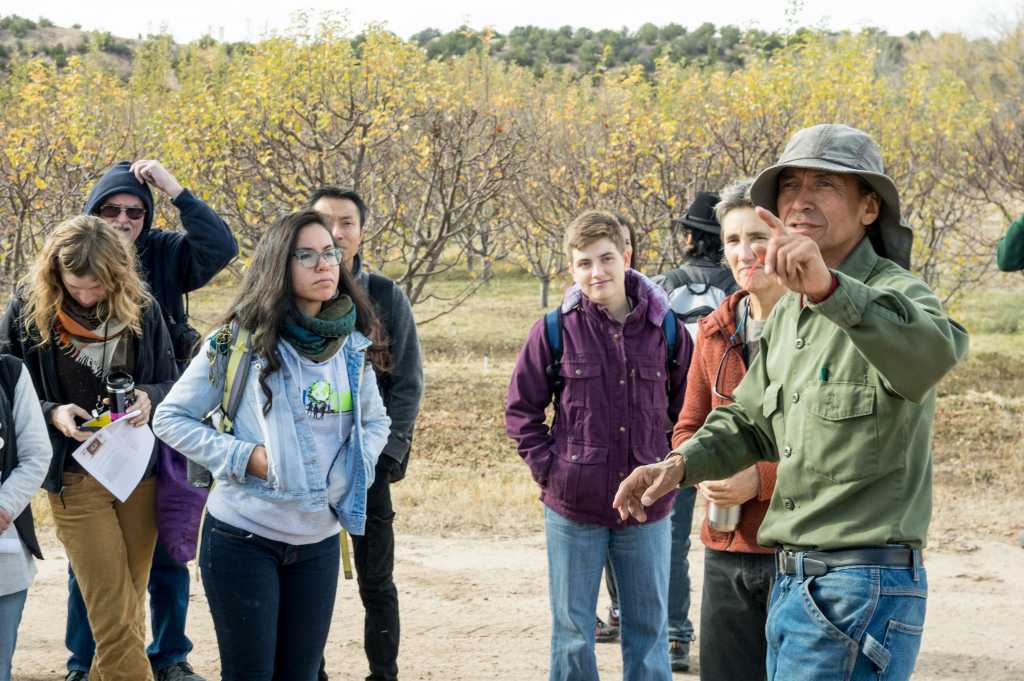 Emigdio Ballon during a pre-conference field day to Tesuque Pueblo, where members of the Pueblo have developed farm fields, orchards, greenhouses, compost, and a seed bank